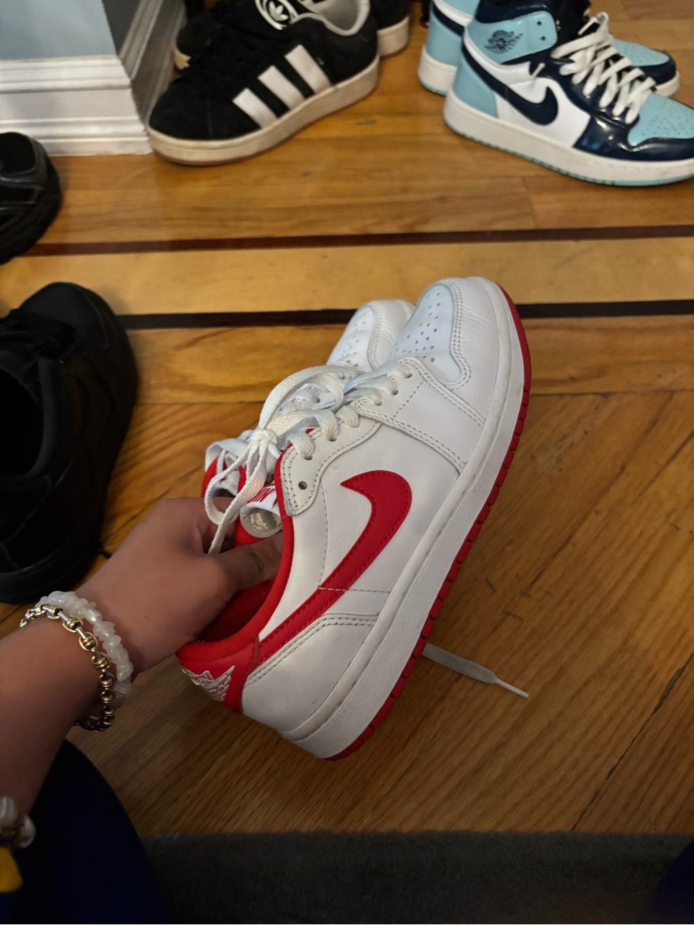 Nike Kids White and Red Low-Top Sneakers with Red Swoosh